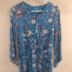 long sleeved blue floral romper with pockets
